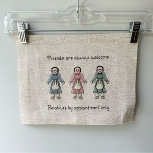 Handmade cross stitch sampler with rag dolls
